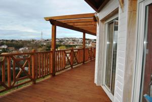 a balcony with a view of a city at Chambre sur jardin, proche plage in Bidart