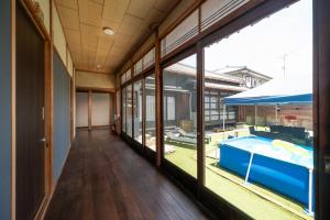 a room with a pool and large windows at Chizu - Vacation STAY 83880v in Mitoyo