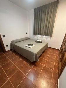 Ένα ή περισσότερα κρεβάτια σε δωμάτιο στο Casa Rural Villa Ribatejada