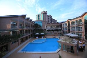 an overhead view of a swimming pool in a building at Lemigo Hotel in Kigali