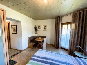 a hotel room with a bed and a table at Apartment Klapo in Bad Gastein