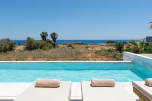 a villa with a pool and a view at Seadream - Luxury Villa - Pool & Sea View in Lachania