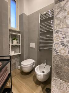 a bathroom with a toilet and a sink at Dimora del Papa apartments in Rome