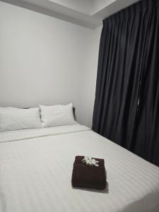 Ένα ή περισσότερα κρεβάτια σε δωμάτιο στο Jenz Homestay - 2