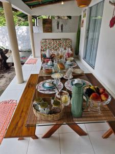 a table with food on it in a room at Ranch Dias Atins in Atins