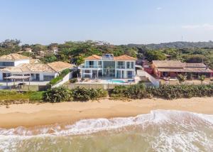 an aerial view of a house on the beach at casamarpenaareia in Búzios