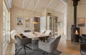a dining room with a table and chairs at Cozy Home In Sydals With Sauna in Sarup
