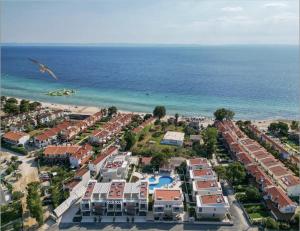 an aerial view of a resort near the ocean at Darion Luxury Villa Nikiti Chalkidiki in Nikiti