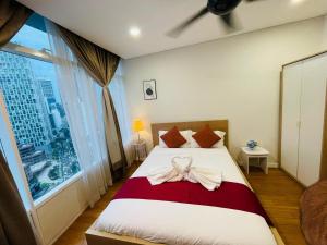 Postel nebo postele na pokoji v ubytování Vortex Hotel Suites & Residence by KLCC + 63 fotografií