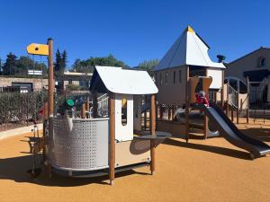 a small playground with a slide and a slideintend at Camping Mas De Pierredon in Sanary-sur-Mer