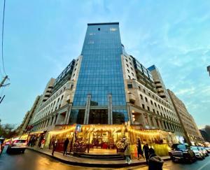 a tall building with christmas lights in front of it at Prime apartment in Buzand 17 in Yerevan