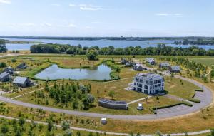 an aerial view of a resort with a lake at Cozy Apartment In Kamperland in Kamperland +25 photos