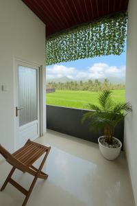 Μπαλκόνι ή βεράντα στο Puri Indah Inn Guest House +5 φωτογραφίες