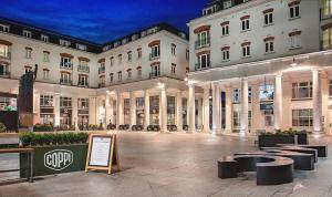 a large building with a sign in front of it at Luxury Living Cathedral Quarter Cafes Bars in Belfast