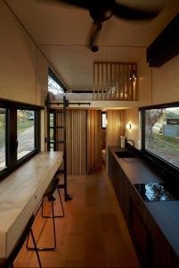 a kitchen with a counter and a fish tank at Nestled Cabins 