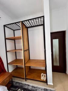 a room with a closet with wooden shelves at 1 Bedroom- Tranquil Meru Retreat in Nkoanrua