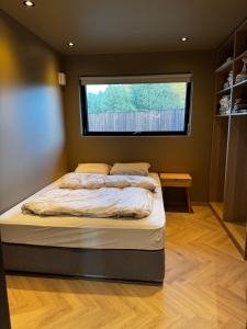 Postel nebo postele na pokoji v ubytování Stort og stilfult hjem med attraktiv beliggenhet