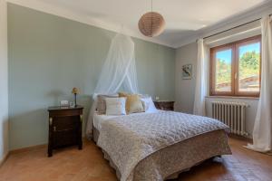 Ένα ή περισσότερα κρεβάτια σε δωμάτιο στο Casale Nido by Great Stays +49 φωτογραφίες