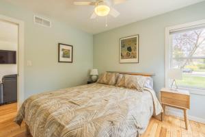a bedroom with a bed and a window at Experience lakeside tranquility at The 9 in Douglas