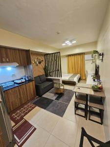 a living room with a couch and a table at Modern Studio in Tower 3 in Cebu City