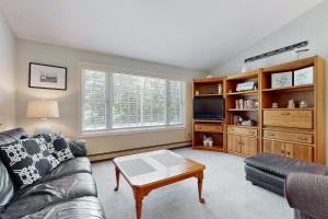a living room with a couch and a tv at The Lucky Lobster in York