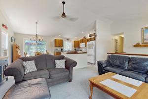 a living room with two couches and a kitchen at The Lucky Lobster in York