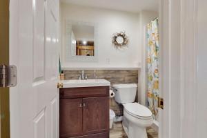 a bathroom with a toilet and a sink and a mirror at The Lucky Lobster in York +16 photos