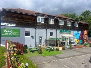 a building with a picnic table in front of it at Sutherlands Hotel in Gateshead