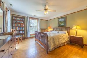 a bedroom with a bed and a ceiling fan at Elsie in Benton Harbor
