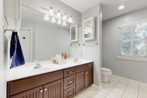 a bathroom with a sink and a mirror at SkyNest in Running Springs +12 photos