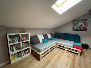 a room with a bed and a book shelf at Typical Toulouse house completely renovated in Launaguet