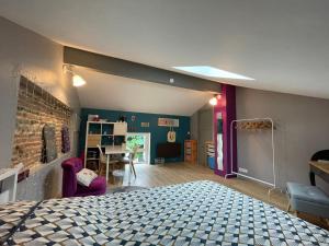 a bedroom with a bed and a room with a table at Typical Toulouse house completely renovated in Launaguet +19 photos