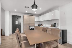 a kitchen and dining room with a table and chairs at Condo with 1 Bedroom Terrace and Hot Tub in Hollywood +62 photos