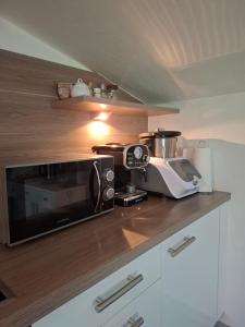 a kitchen with a microwave and a toaster oven at Stubainest Schmidt Ferienwohnung in Fulpmes +9 photos