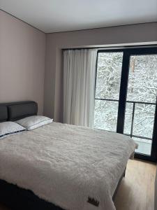 Ένα ή περισσότερα κρεβάτια σε δωμάτιο στο Likani apartment 2 room