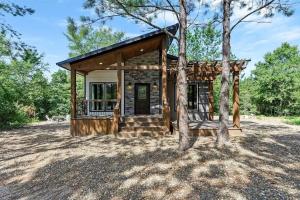 a cabin in the woods with a tree at BEARLY BEHAVIN NEW SEXY Cabin Adult Getaway in Broken Bow