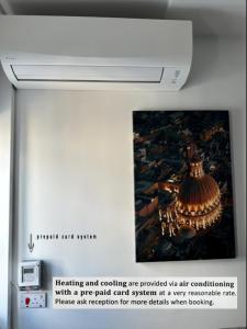 a picture of a painting on the wall in a museum at For Rest Aparthotel in St Paul's Bay