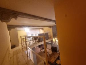 an overhead view of a living room with a table and chairs at Casa Via Cittadella in Piacenza +8 photos