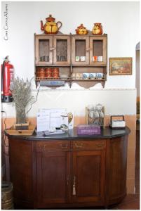 a wooden cabinet with a black counter top at Casa Cueva Alhama in Graena