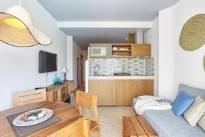 Телевизор и/или развлекательный центр в Apartamentos Castaví