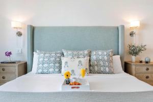 a bedroom with a large white bed with a tray on it at MVR-No More Hassles-Just Peace & Luxury in Miami