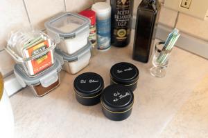 a group of containers sitting on top of a counter at Dolomitihouse CASTAGNER in Fiera di Primiero