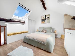 Ένα ή περισσότερα κρεβάτια σε δωμάτιο στο Charmant appartement à Saint-Germain-en-Laye