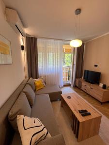 a living room with a couch and a coffee table at Orientale in Belgrade