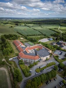 an overhead view of a school building with a parking lot at Comwell Rebild Bakker in Skorping