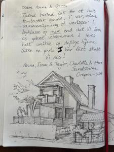 a drawing of a house in a notebook at Villa Wiegand - a room with a view in Holbæk