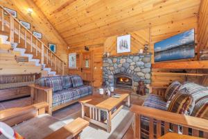 a living room with a fireplace in a cabin at Jester Court home in Tahoe Vista