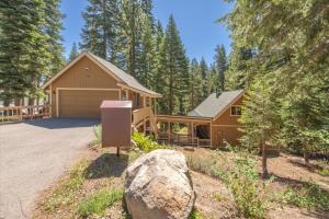 a house with a garage in the woods at Jester Court home in Tahoe Vista
