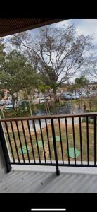 a view of a park from a balcony at Apartamento 34 in Pirenópolis