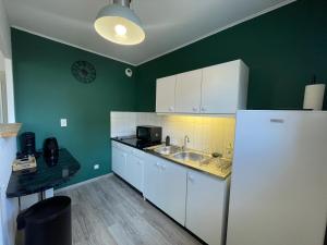 Dapur atau dapur kecil di Le logis de Mel HYPER CENTRE VILLE ÉPERNAY